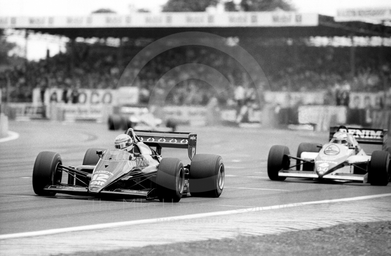 Ayrton Senna, JPS Lotus 97T, Keke Rosberg, Williams FW10, 1985 British Grand Prix, Silverstone.
