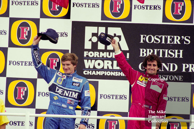 Thierry Boutsen and race winner Alain Prost on the podium at Silverstone, 1990 British Grand Prix.
