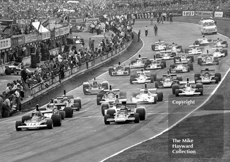 Niki Lauda, Ferrari 312B3, and Ronnie Peterson, Lotus 72, on the front row of the grid for the start of the 1974 British Grand Prix at Brands Hatch.
