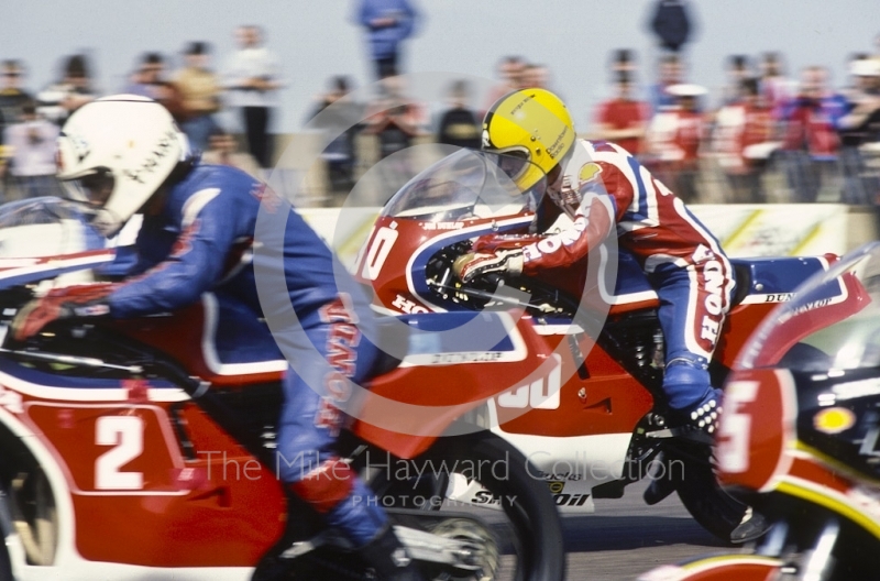 Joey Dunlop, Honda, leaves the grid just behind Ron Haslam, also riding a Honda, at Donington Park, April 1982.