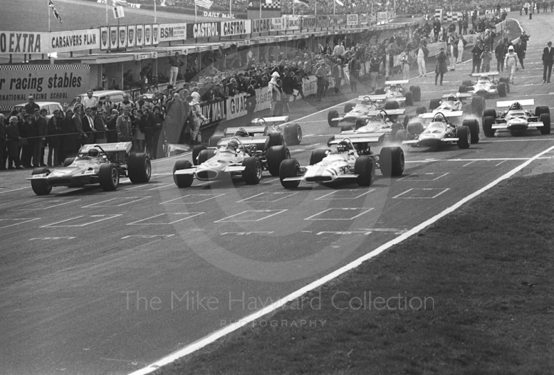 Jackie Stewart, Tyrrell March-Ford 701, Jack Brabham, Brabham BT33, and Jack Oliver, Yardley BRM P153 V12, on the front of the grid, Race of Champions, Brands Hatch, 1970.
