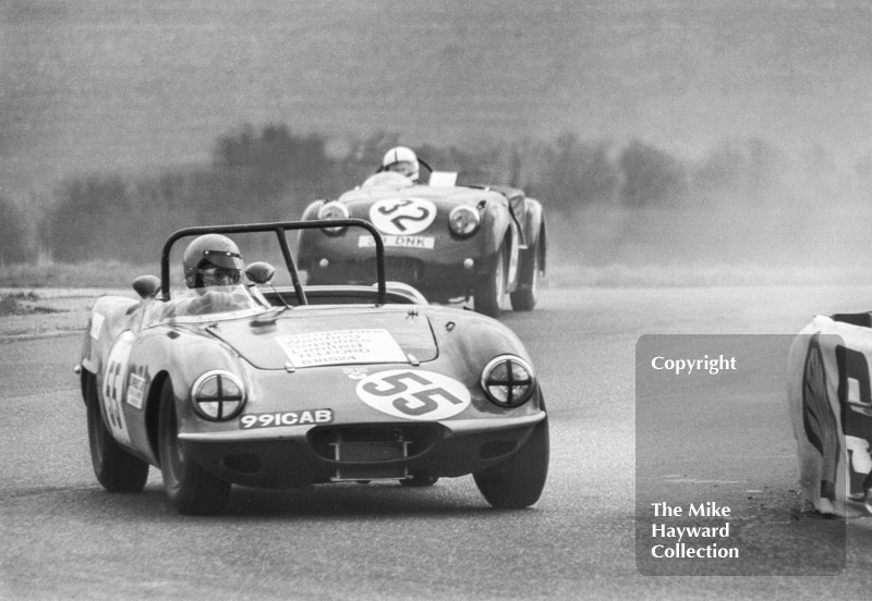 Ken Heywood, Elva Courier Mk 1 (991 CAB), followed by Andrew Ledingham, Triumph TR3A (33 DNK), Philips Car Radio Thoroughbred Sports Car race, F2 International meeting, Thruxton, 1977.
