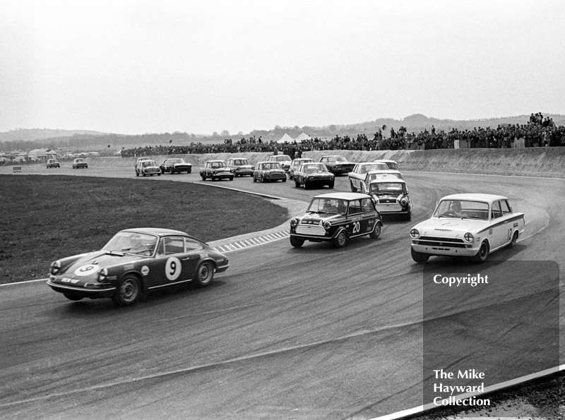 Vic Elford, Porsche 911, BEM 911F,&nbsp;ahead of John Rhodes, Mini Cooper S, and Tony Dean, Lotus Cortina, on the first lap at Campbell Corner, Thruxton Easter Monday meeting 1968.
