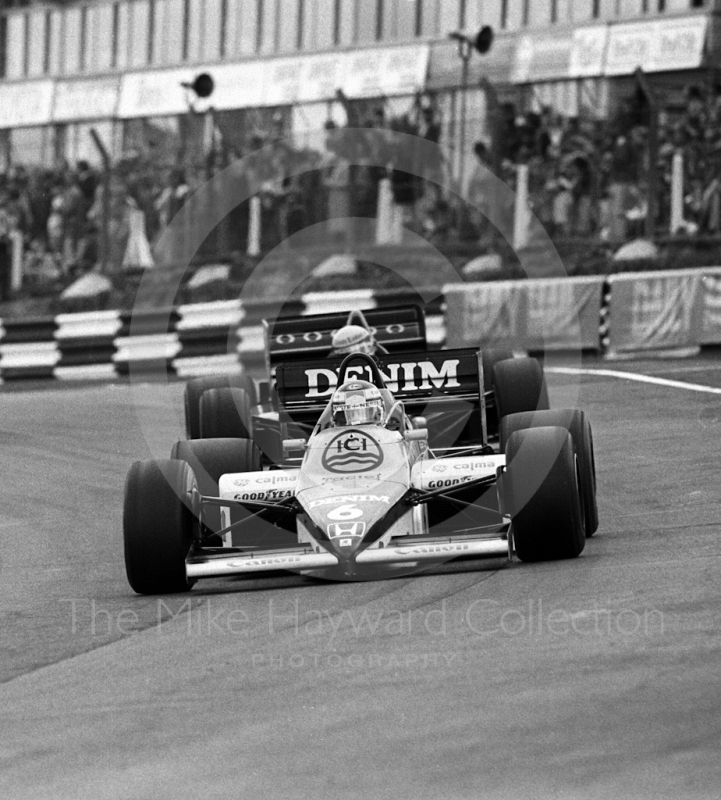Keke Rosberg, Williams FW10/7, leads Ayrton Senna, JPS Lotus 97T-4, through Paddock Bend, 1985 European Grand Prix, Brands Hatch
