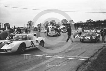 Skip Scott, Essex Wire Corporation Ford GT40, and Peter Sutcliffe, Ford GT40, Silverstone International Trophy meeting 1966.
