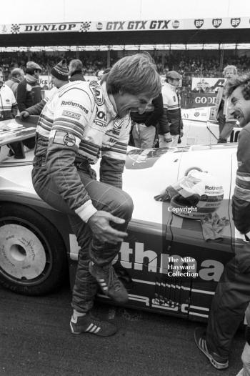 Derek Bell enjoys a joke on the grid before sharing a Rothmans Porsche 956 with Stefan Bellof and finishing 10th, World Endurance Championship, 1985 Grand Prix International 1000km meeting, Silverstone.
