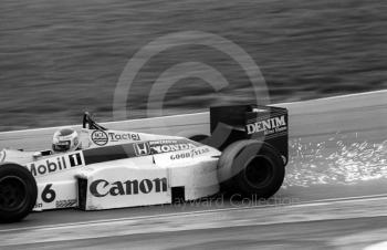 Sparks fly as Keke Rosberg, Williams FW10, exits Paddock Bend, Brands Hatch, 1985 European Grand Prix.
