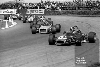 David Purley, LEC Brabham BT28, leads the pack at Copse Corner, followed by Barrie Maskell, Chevron B18, GKN Forgings Trophy, International Trophy meeting, Silverstone, 1971.
