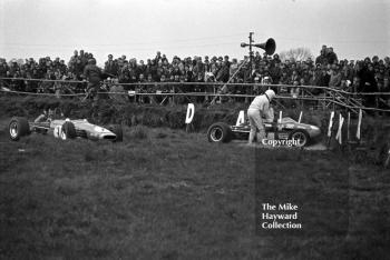 Paul Purseglove is helped out of his Brabham BT28, with Chris Montague's Brabham also out at Copse Corner, Silverstone, during the 1970 International Trophy.
