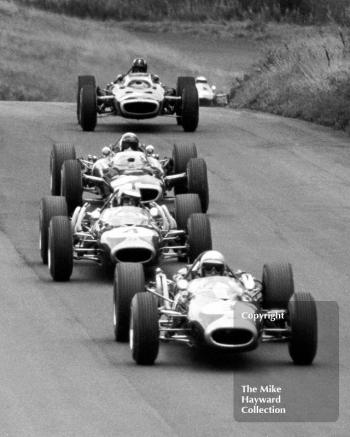 Jack Brabham, Repco BrabhamÂ BT19,Â Denny Hulme, BT20,Â Jackie Stewart BRM P83 H16,Â Graham Hill, BRM P83 H16; and Jim Clark, Lotus Climax 33, Oulton Park Gold Cup 1966.