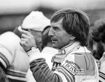 Derek Bell, Rothmans Porsche, makes a point on the grid, World Endurance Championship, 1985 Grand Prix International 1000km meeting, Silverstone.
