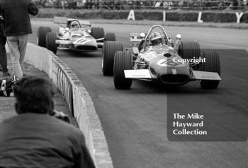 Piers Courage, Brabham Cosworth BT26A, leads Chris Amon, Ferrari 312, at Copse Corner, Silverstone, 1969 British Grand Prix.
