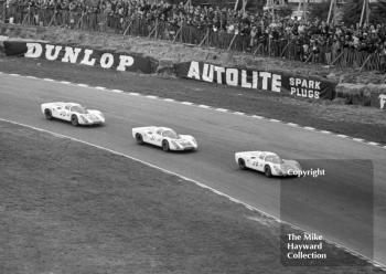 The Porsche team at Paddock Hill bend on the first lap at the BOAC 500, Brands hatch, 1968. From the front, the cars and drivers are as follows.<br />
<br />
38 - Gerhard Mitter/LudovicoScarfiotti, Porsche 907<br />
37 - Jo Siffert/Hans Herrmann, Porsche 907<br />
36 - Vic Elford/Jochen Neerpasch, Porsche 907
