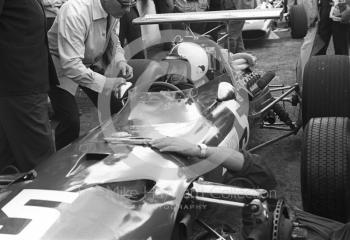 Chris Amon in the pits with his Ferrari 312 0011 V12 during practice for the 1968 British Grand Prix at Brands Hatch.
